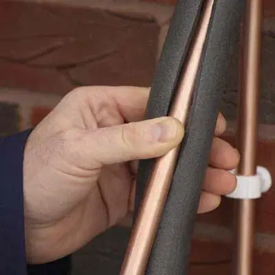 Water pipes wrapped in foam insulation.