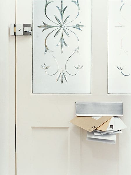 Window film with cut outs mimics etched glass on a door.