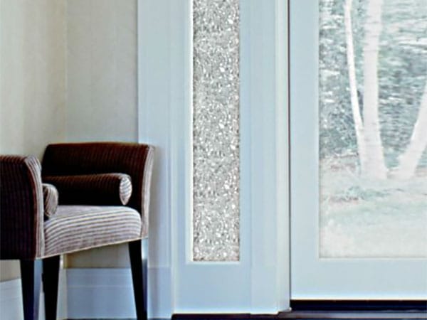 Decorative window film used to cover sidelights by a front door.