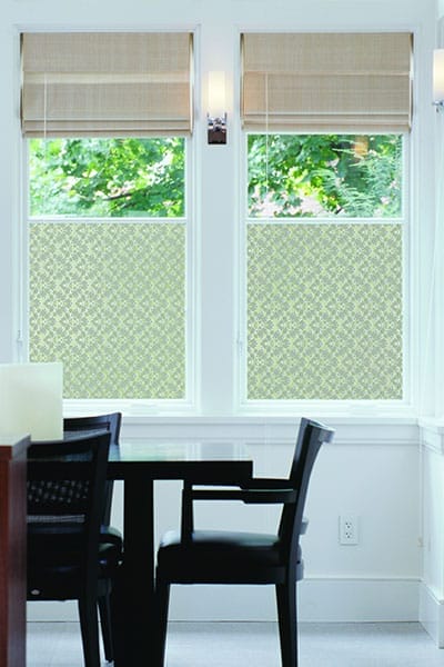 Two windows half covered in window film.