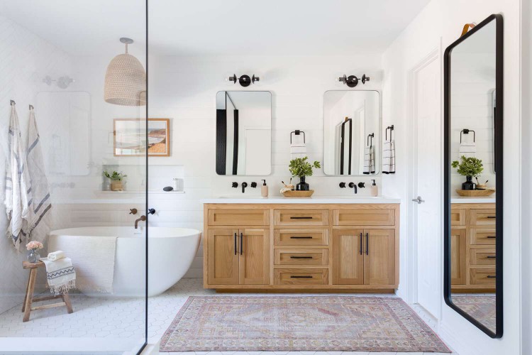 White bathroom with a purple rug.
