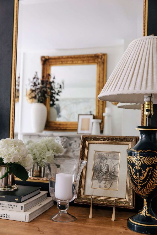 artwork on easel on dresser