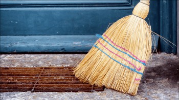 a broom sweeping the sidewalk holiday traditions