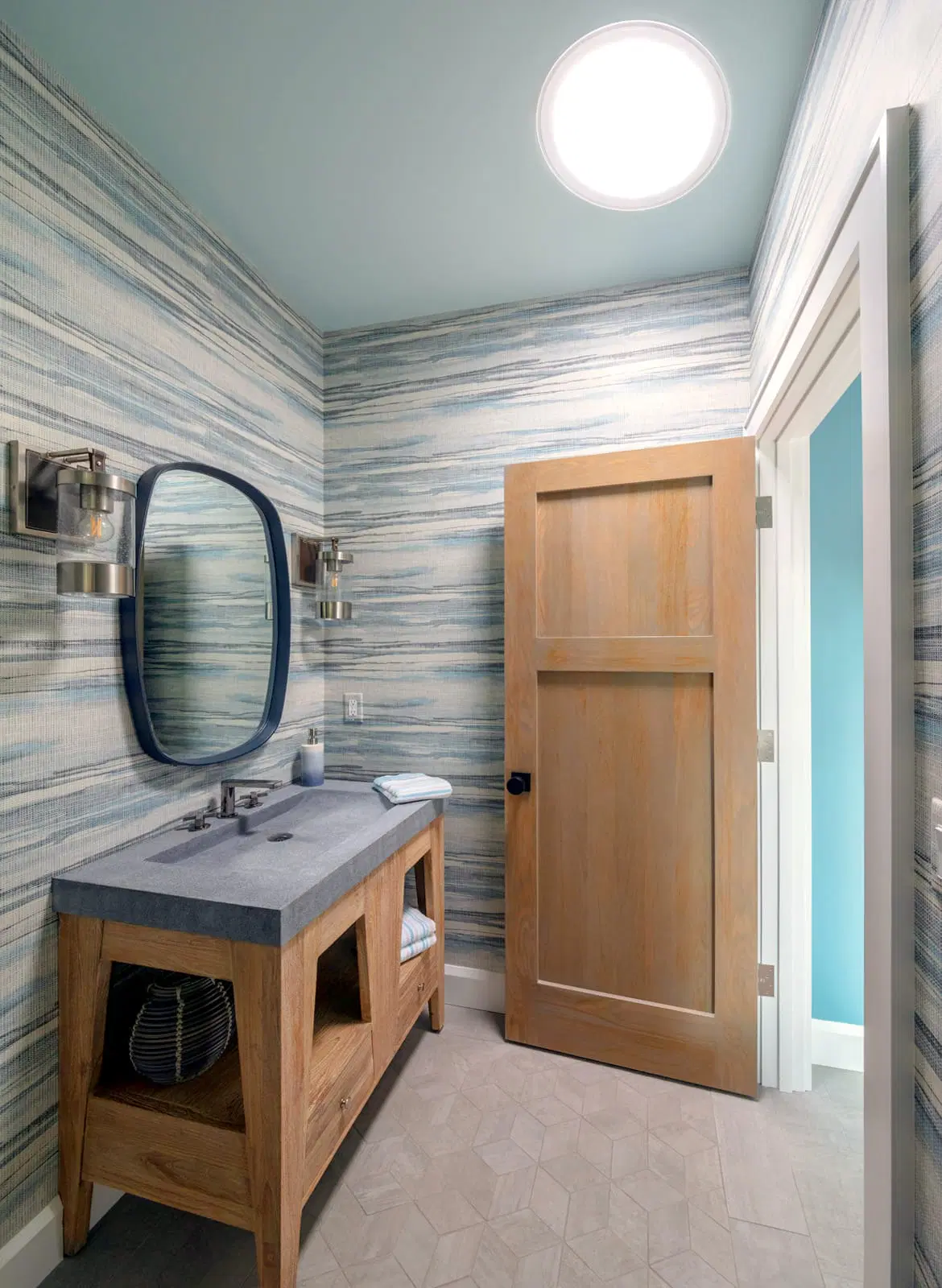 a bright skylight in a small bathroom