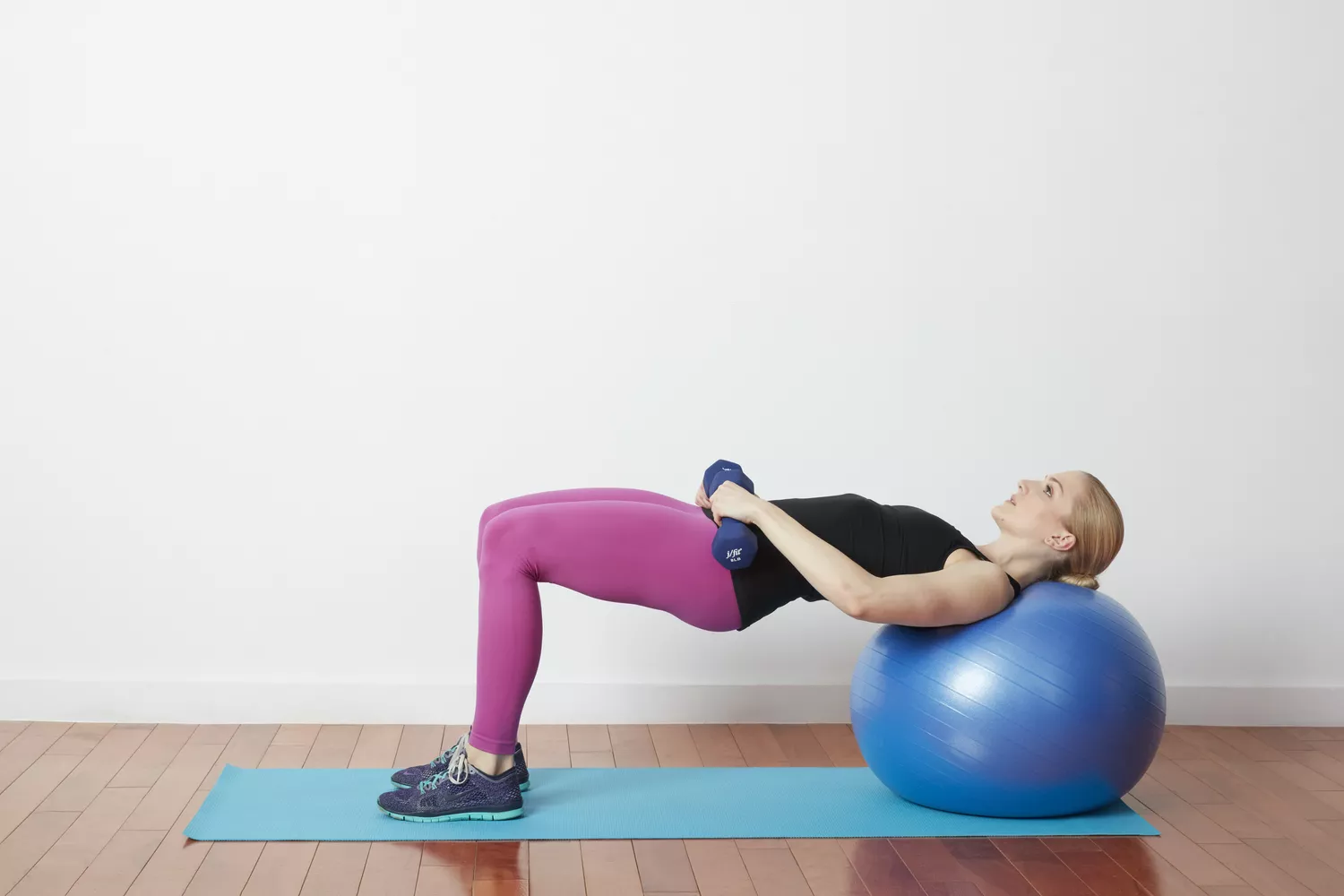 Bridge hip thrust with dumbbells