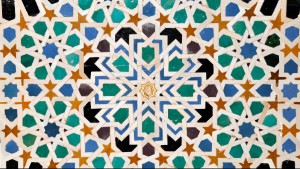 A close-up of some of the tilework that can be found in the Spanish palace, with many geometric shapes in various colors.