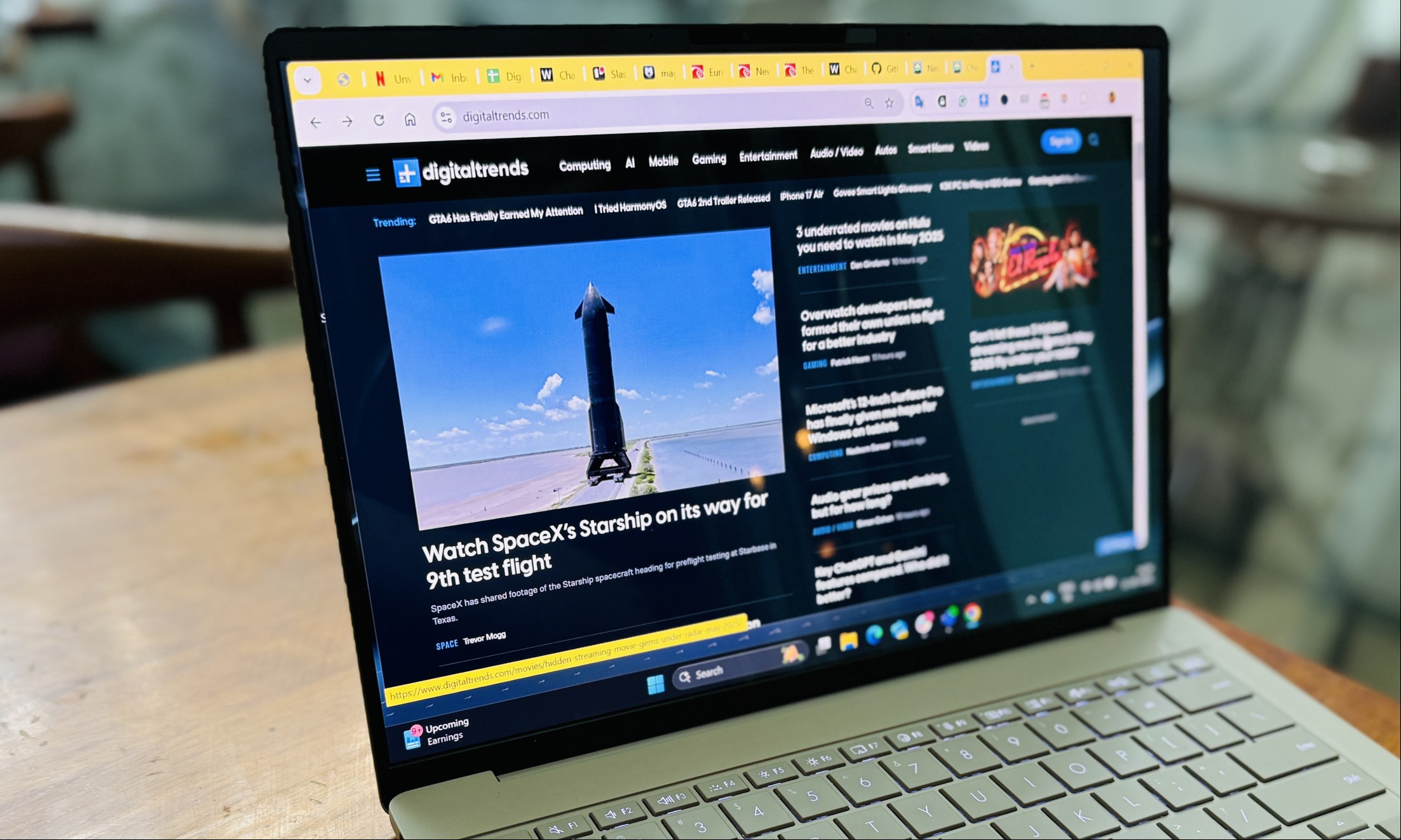 Browsing a website on Asus ZenBook A14 laptop.