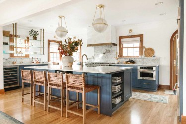 Mid century modern kitchen with blue and natural wood.