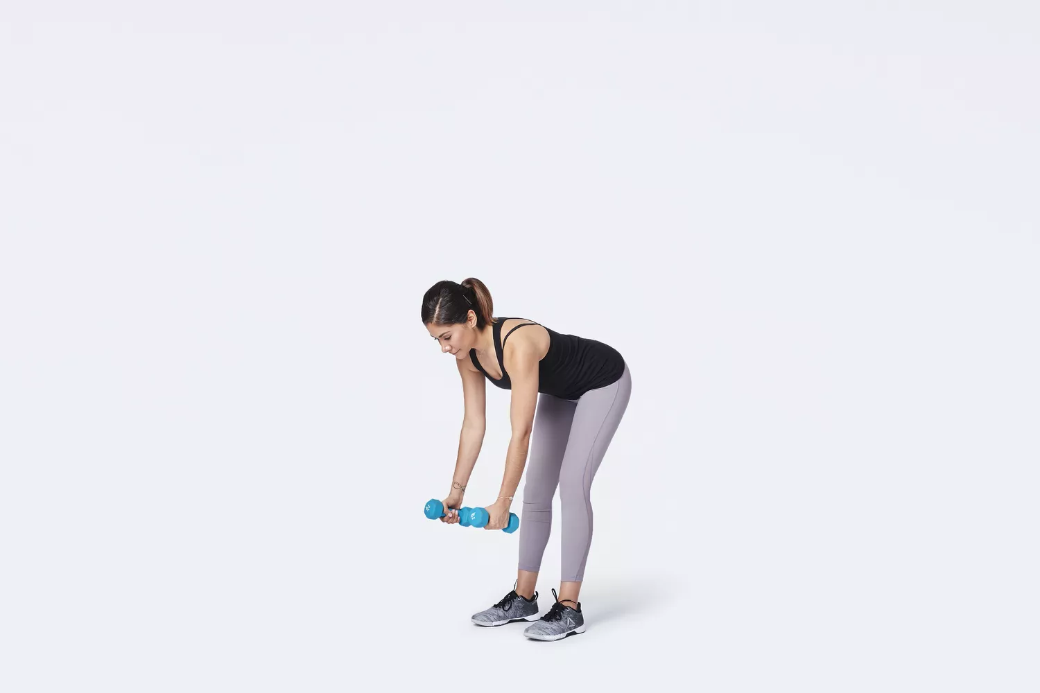 woman starting dumbbell bent over row