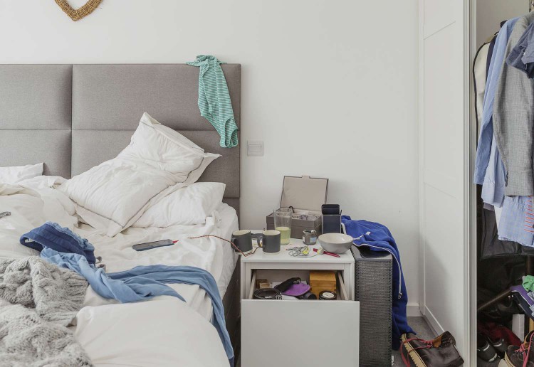 messy bedroom with clothes everywhere