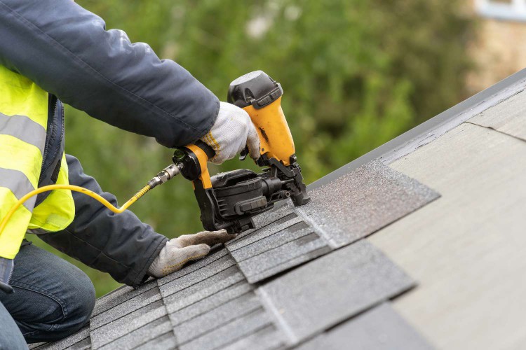 Person repairing a roof