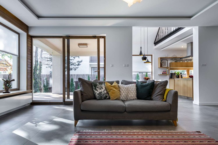 Tiny couch in a large living room