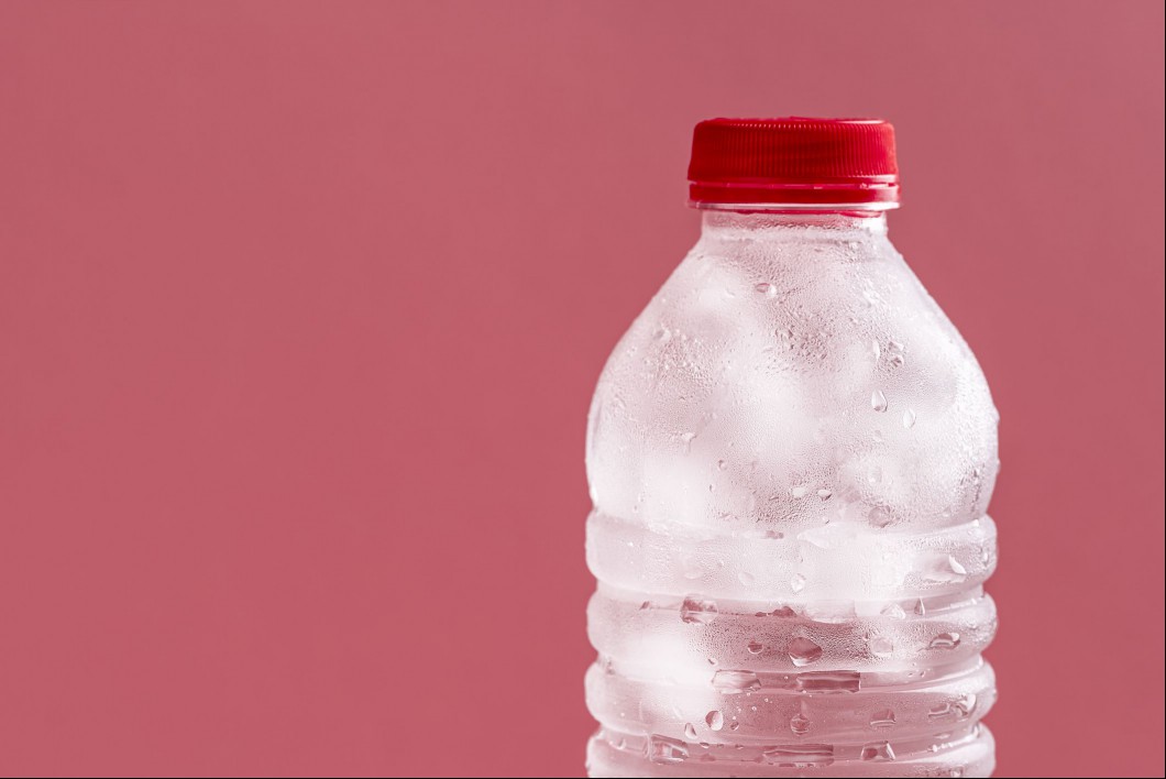 Water bottle with ice cubes in it.