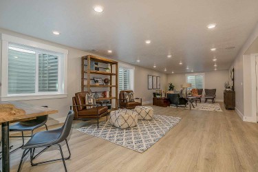 Basement living room with recessed lights across ceiling