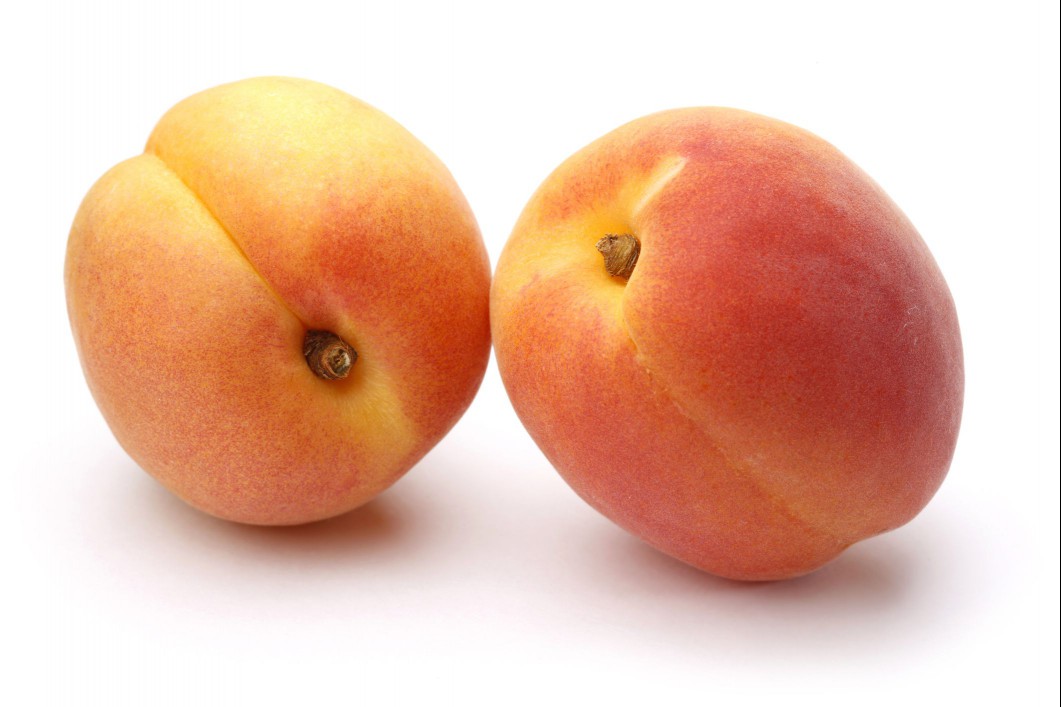 Two ripe apricots.