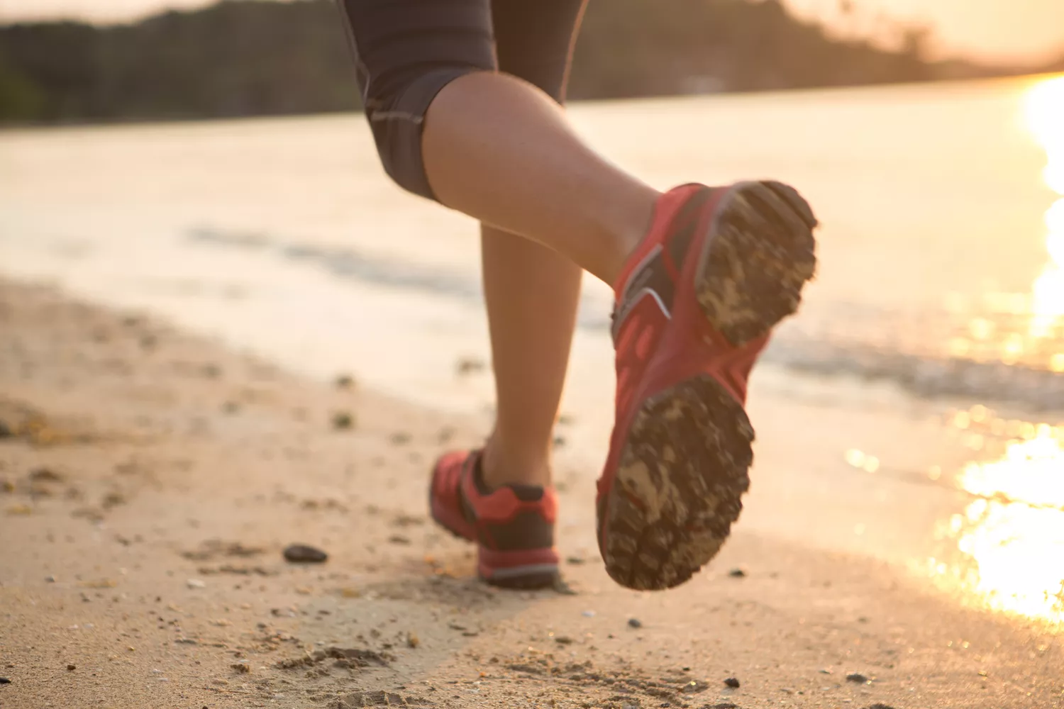 Running on the beach at sunset