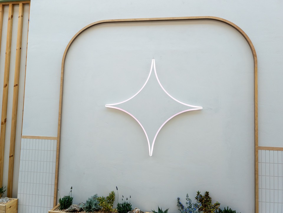 Gemini Logo on the side of the Google Gemini booth at MWC 2025