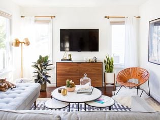Mid century inspired small living room with round accents
