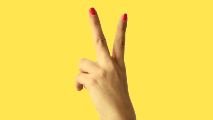 hand making backwards peace sign