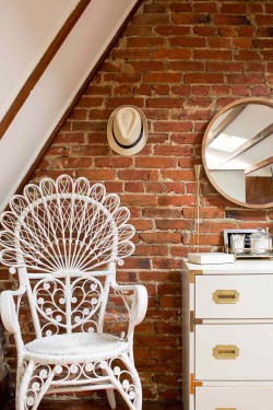 exposed brick wall in bedroom