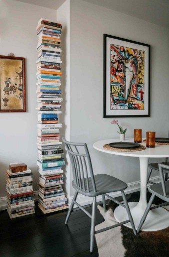 tulip table next to bookshelf