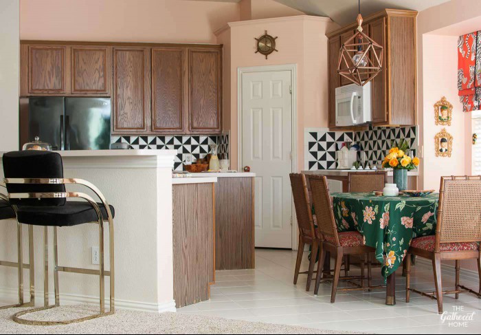 kitchen with wood cabinets and pink walls