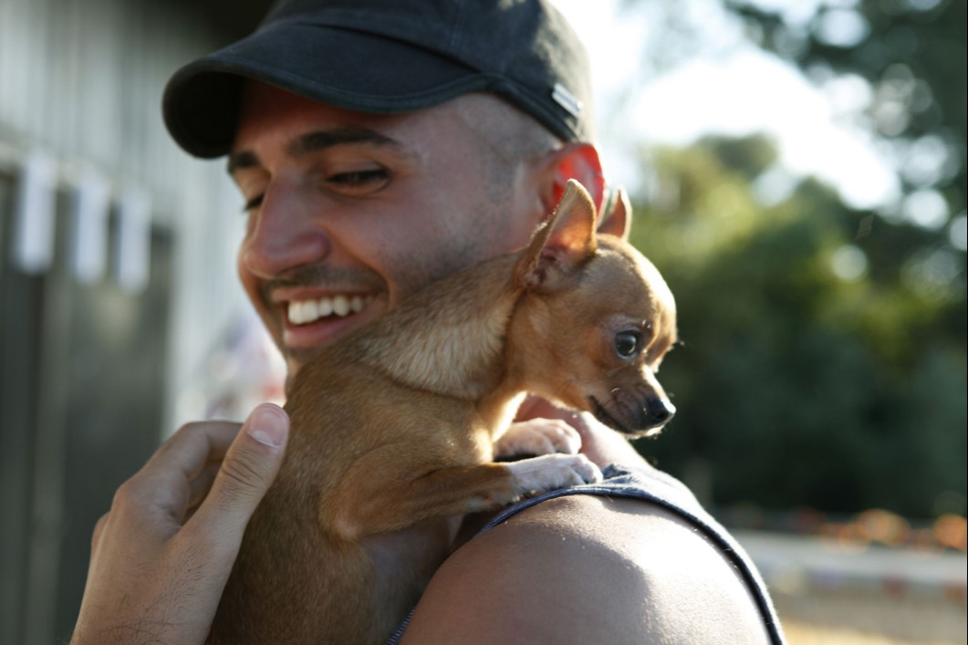 Man carrying chihuaha