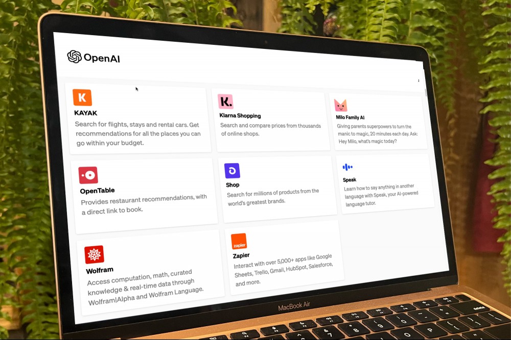 OpenAI's website open on a MacBook, showing ChatGPT plugins.