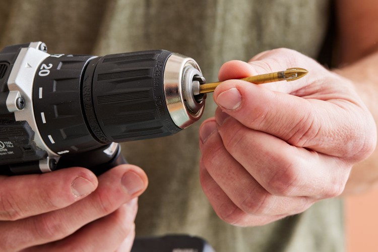 Attaching a drill bit to the drill