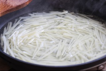 Blanch the shredded potatoes