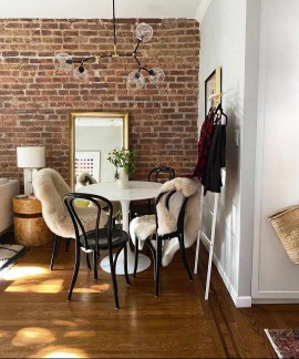 bistro table with sheepskin throw on chairs