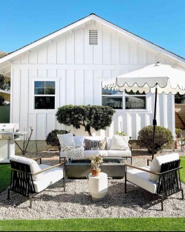 small gravel patio with umbrella
