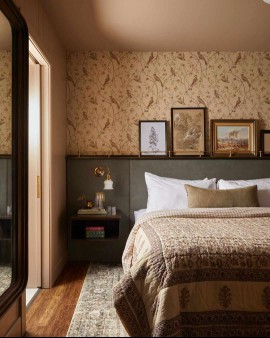 Beige and sage farmhouse bedroom with wood and brass picture rail