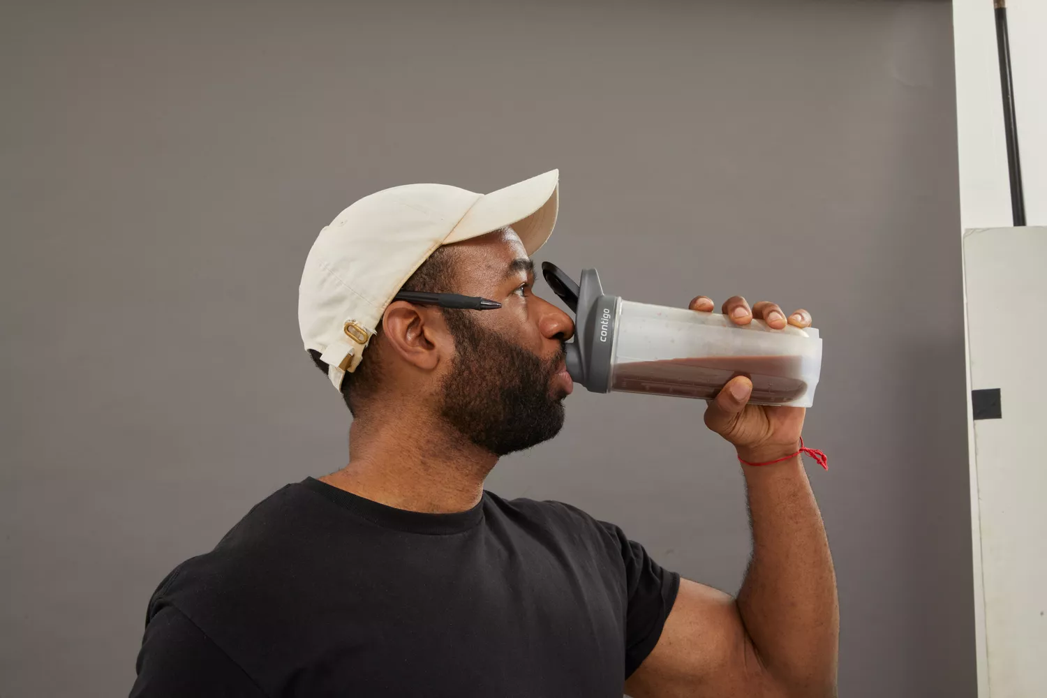 Person drinking from shaker bottle