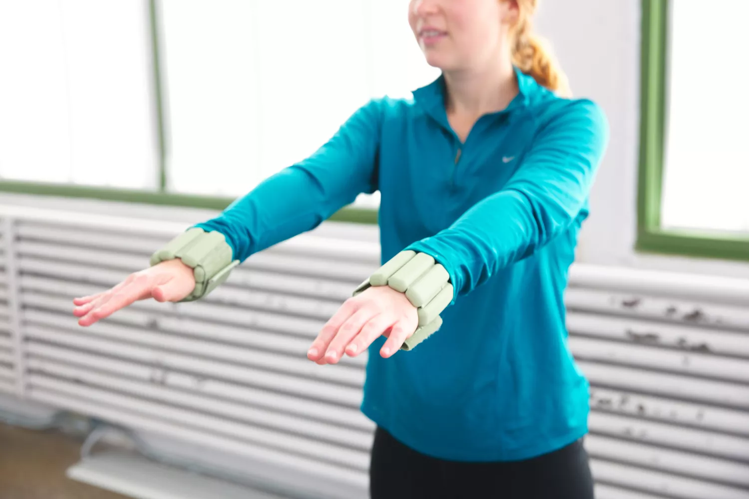 Person holding out their arms with Bala Bangles on their wrists