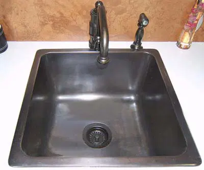 Image of a large square metal bar sink