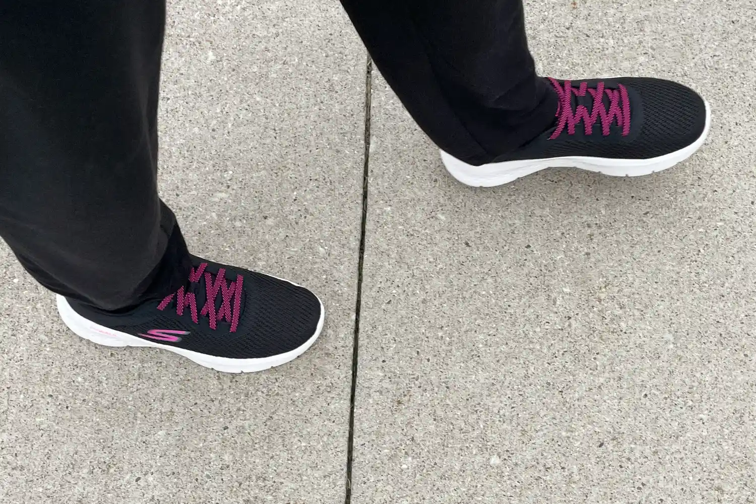 Person wearing Skechers Go Walk Flex Alani Walking Shoes on sidewalk