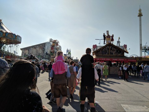 Kids riding on parent's shoulders at Munich's annual Oktoberfest festival