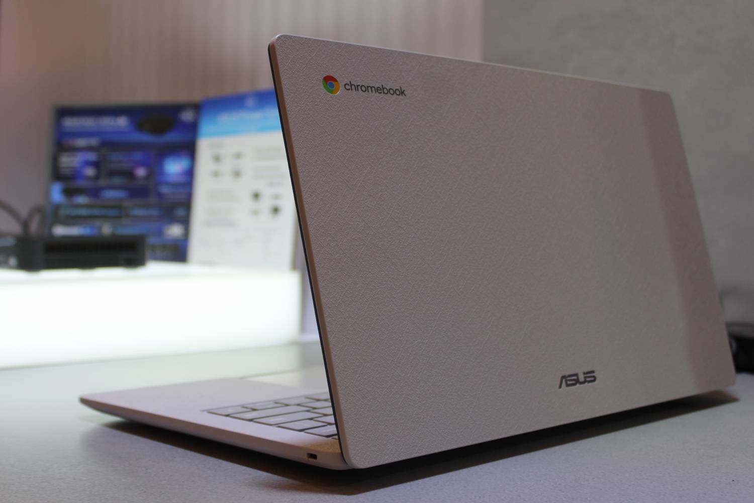 The lid of the Asus Chromebook CX14 on a table.
