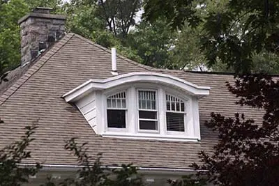 A house with rooftop dormer windows.
