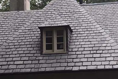 A roof with a dormer window.