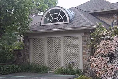 A building with a half round dormer window.