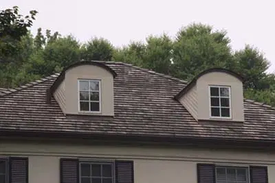 A building with arched top dormer windows.