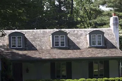 Image of dormers aligned on the roof of a house. Aligning dormers creates a more cohesive appearance
