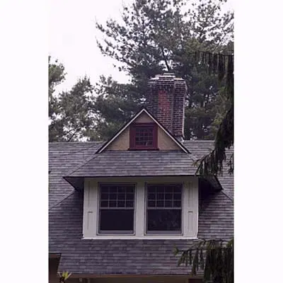 Image of a dormer on a house. Dormers use the concept of a vanishing point to add depth and structure to a house. 
