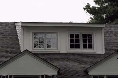Image of a wide shed dormer on a house. These types of dormers are good for when you need more space on the upper floors of your home