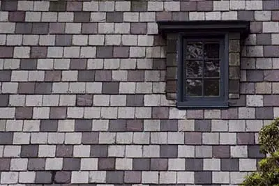 Image of a steep dormer shed on a mansard roof