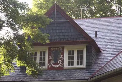 Image of dormer with decorative flourishes