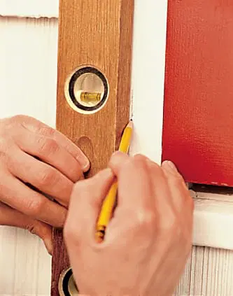 installing the lower hinges on the exterior shutters
