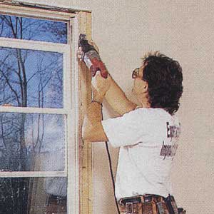 an image of using a reciprocating saw to slice through nails and cut the frame for a french door